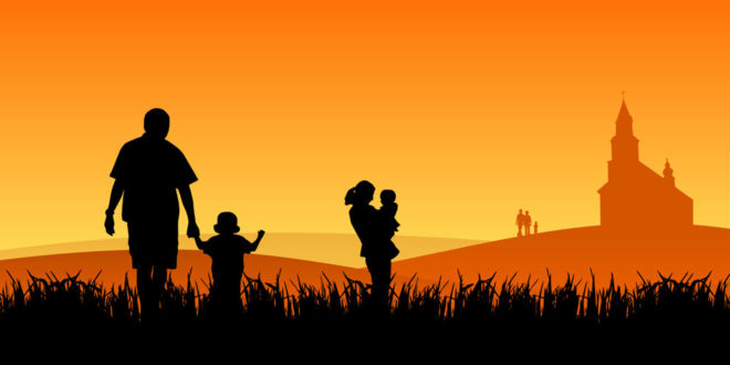 silhouette of family walking to church