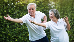 elderly couple exercising