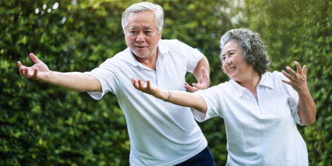 elderly couple exercising