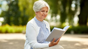 older lady reading a book