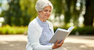 older lady reading a book