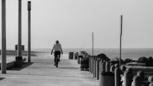 person riding bike on pier