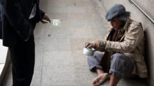 giving money to man on street