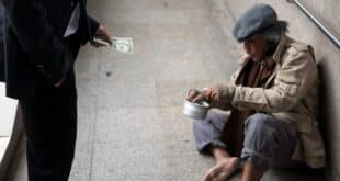 giving money to man on street