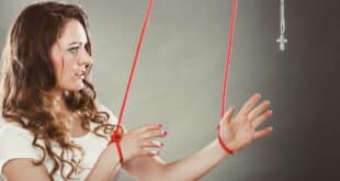 woman with ropes tied around wrists